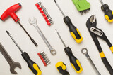 Set of tools on concrete background, top view