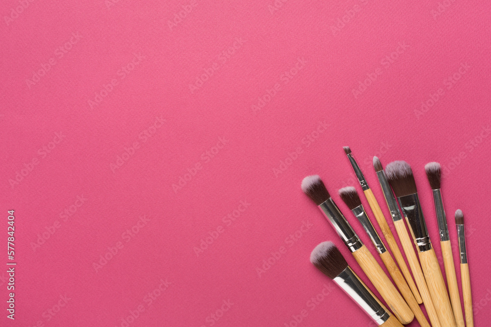 Make up brushes on color background, top view Make up brushes on color background, top view