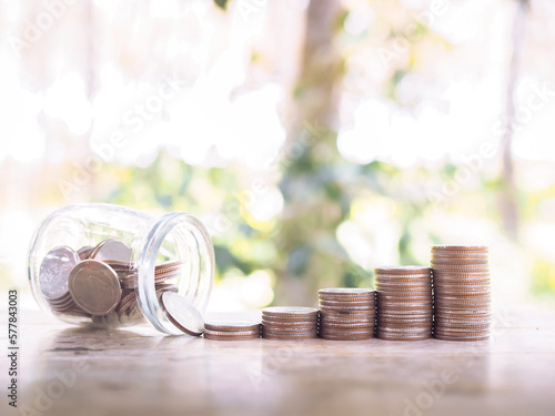 Stack of coins with bottle. The conceptof save money for everything. photo