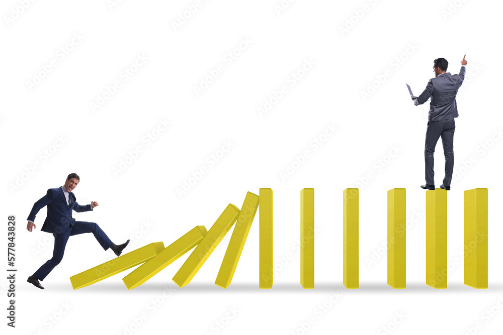 Businessman in domino effect concept Businessman in domino effect concept