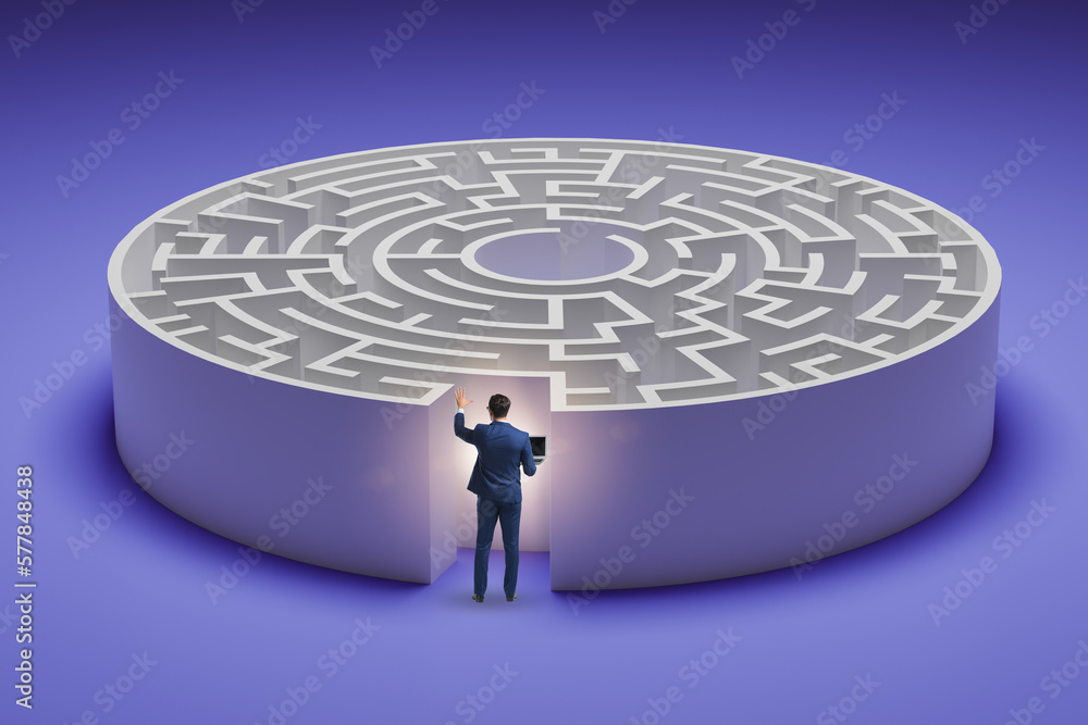 Businessman trying to find a way out of maze Businessman trying to find a way out of maze
