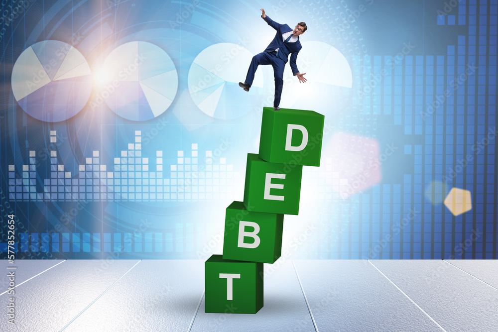 Debt and loan concept with businessman on cubes Debt and loan concept with businessman on cubes