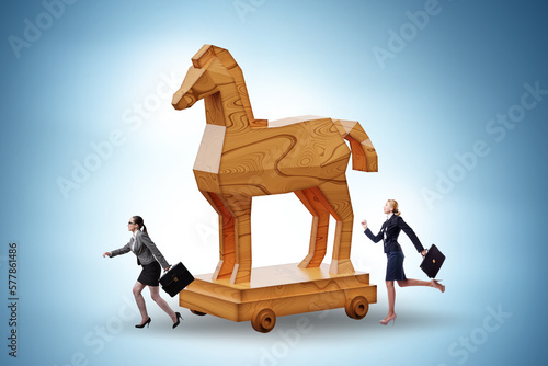 Businesswoman and trojan horse in trap concept