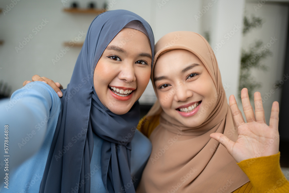 Fashion concept of young Asian muslim woman friends wearing Hijab. Beauty photo. Cosmetics. Skin care. Body care.