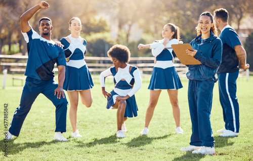 Cheerleader, coach portrait or cheerleading team with support, hope or faith in strategy on field. Sports mission, fitness or cheerleading group in stretching warm up together by happy woman outdoors © J Bettencourt/peopleimages.com