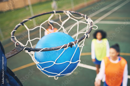 Tableau sur toile Ball in net, netball and sports outdoor with team, fitness and active lifestyle with athlete on court