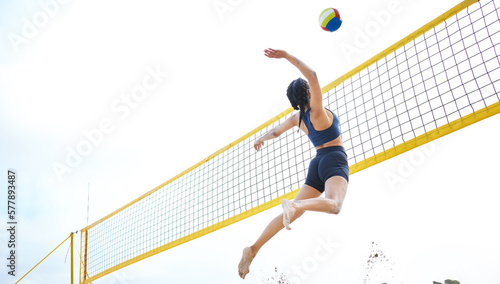 Canvas-taulu Sports, volleyball and woman jump at beach to hit ball in competition, game or match
