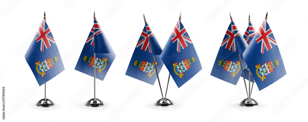 Small national flags of the Cayman Islands on a white background - obrazy, fototapety, plakaty 