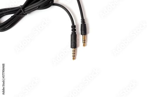 Black cord with a mini jack for connecting various gadgets, shot on a white background.