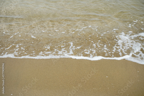 closeup of sea foam on a sandy shore Mockup beach material