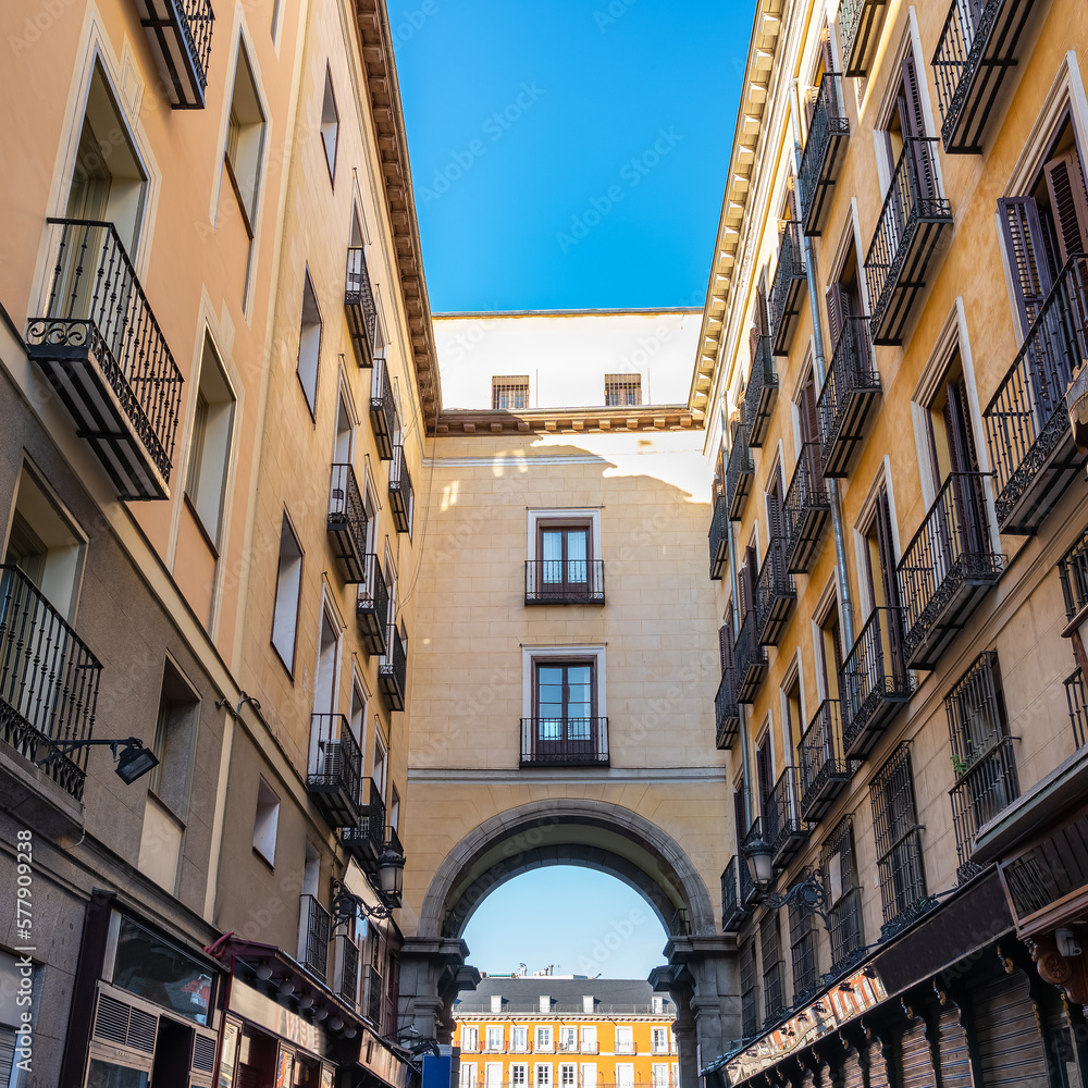 Entrance arch under the houses to the main square of Madrid, Spain.