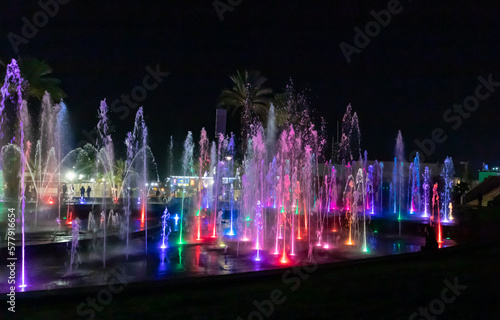 Enchanting grandiose musical performance - water and light show of a musical fountain on the embankment, in the center of the city of Eilat in southern Israel