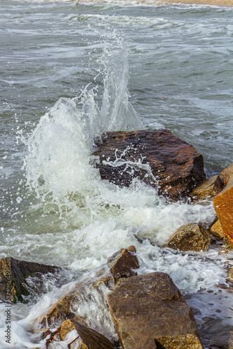 Wallpaper Mural A shot of the sea surf. Splashes of water hitting the stone. Ocean surf among the rocks. Background of the tide. Torontodigital.ca