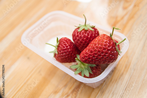 Strawberries in a bowl with Condenced milk photo