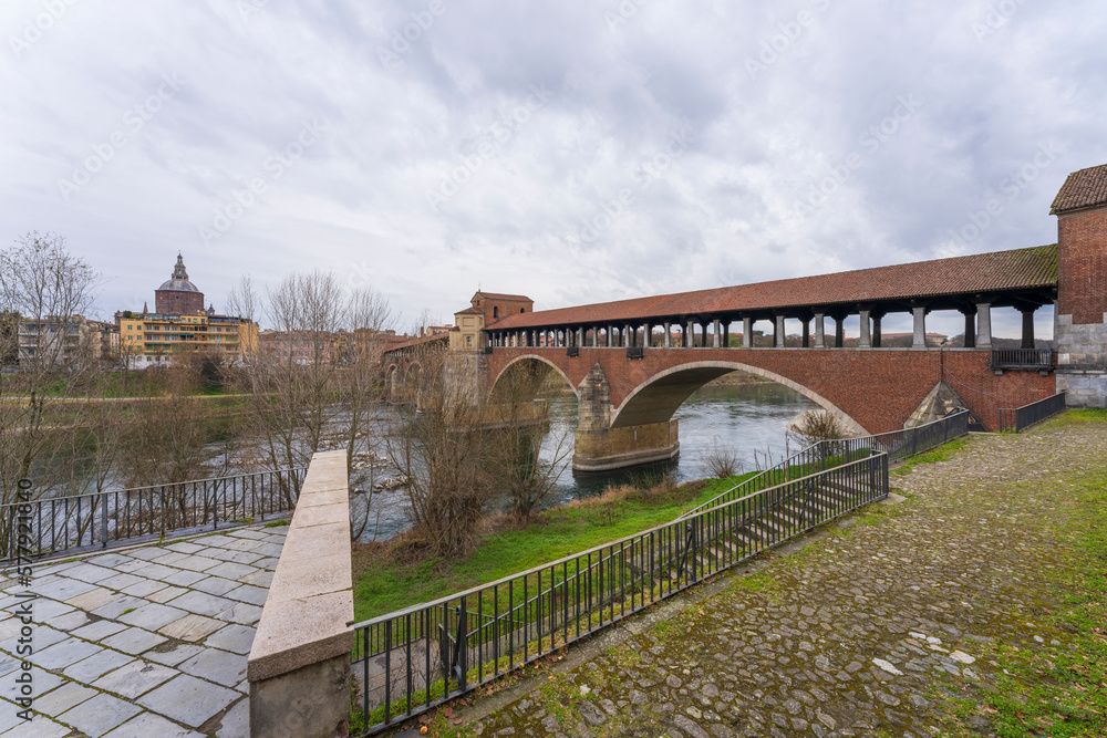 Bridge over Ticino river in Pavia at cloudy day