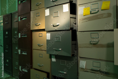 Canvas Print A view of a room full of abandoned filing cabinets.
