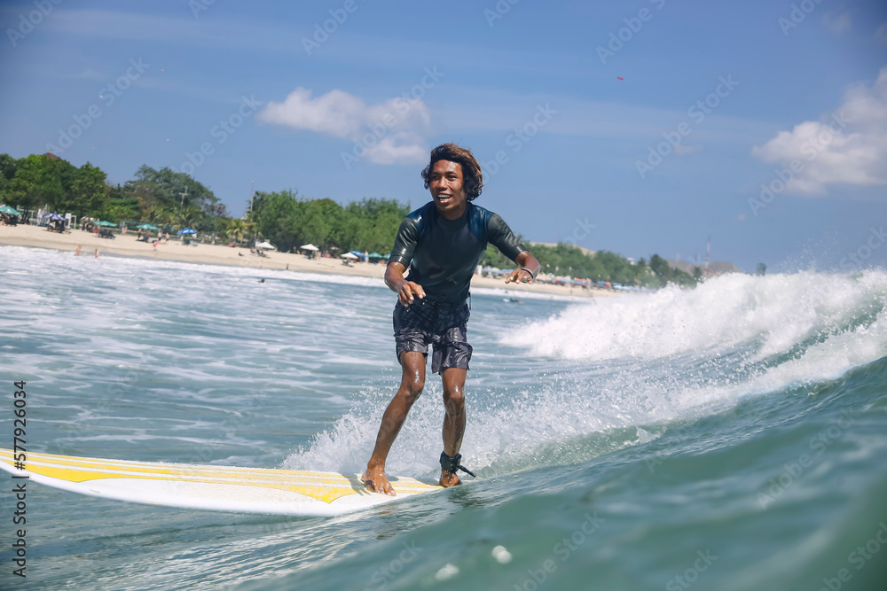 Portrait of carefree smiling man surfing in sea Portrait of carefree smiling man surfing in sea