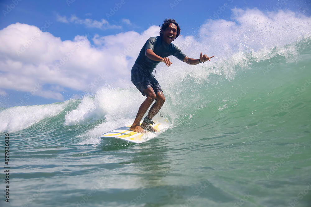 Portrait of carefree smiling man surfing in sea Portrait of carefree smiling man surfing in sea