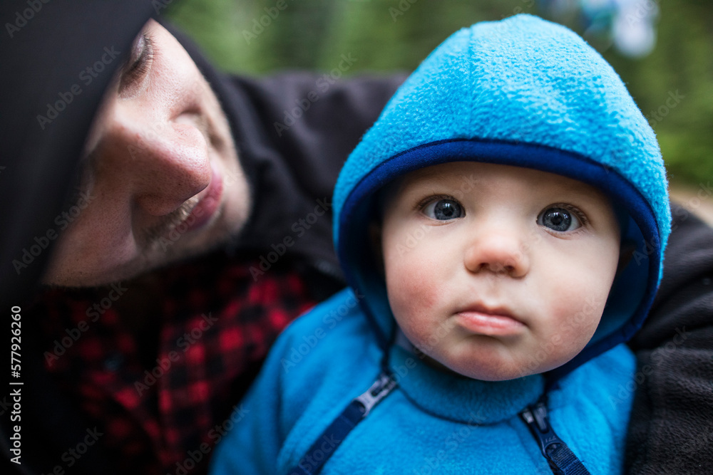 Portrait of father holding his baby outdoors. Portrait of father holding his baby outdoors.
