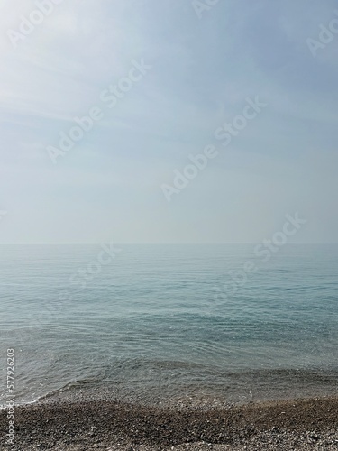 sea landscape with clear water and dust in the air