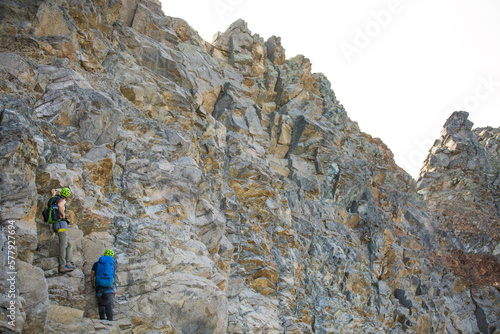 Climbers routefinding on headwall of Douglas Peak, British Columbia. photo