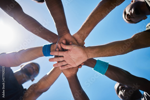 Hands  teamwork and unity for motivation below in sports collaboration  strategy or game cooperation outside. Hand of group piling for team coordination  agreement or partnership in sport meeting