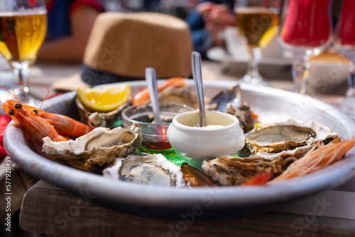 Closeup of oysters and seafood on french terrace.