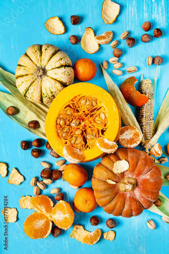 autumn composition with pumpkin and corns
