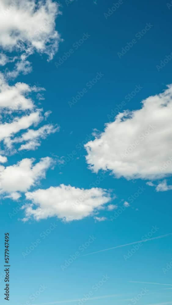 Blue sky and white clouds moving. time lapse. Vertical video Blue sky and white clouds moving. time lapse. Vertical video