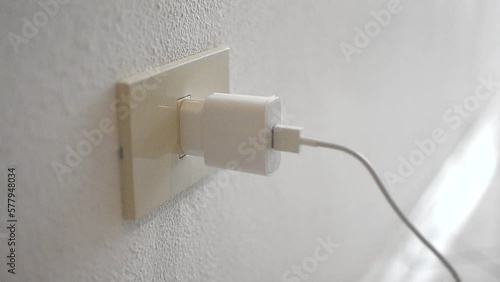 USB power socket, charging of flat phone battery. Insert the white plug into the socket by hand.