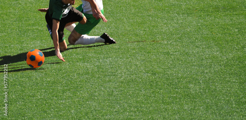 Moment of a soccer player falling when disputing the ball possession