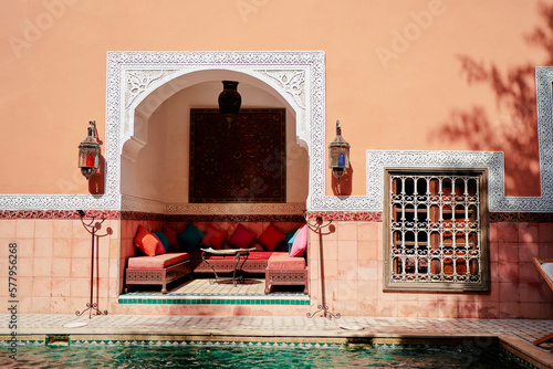 Oriental hospitality. Traveling by Morocco. Relaxing in festive moroccan traditional riad interior in medina. photo