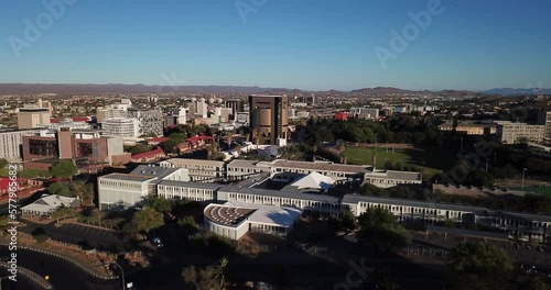 4K aerial drone footage of green hills in city center on sunny morning in Windhoek, the capital of Namibia, southern Africa