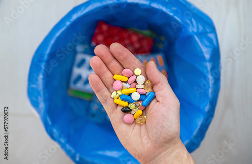 Throw tablets in the trash. Selective focus.