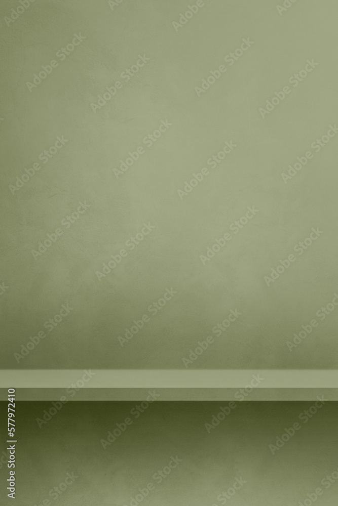 Empty shelf on a khaki green concrete wall. Background template. Vertical mockup Empty shelf on a khaki green concrete wall. Background template. Vertical mockup