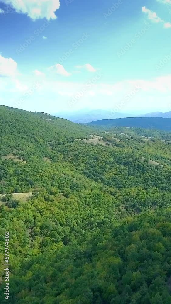 Aerial scenery, green nature, wooded hills, vertical short video Aerial scenery, green nature, wooded hills, vertical short video