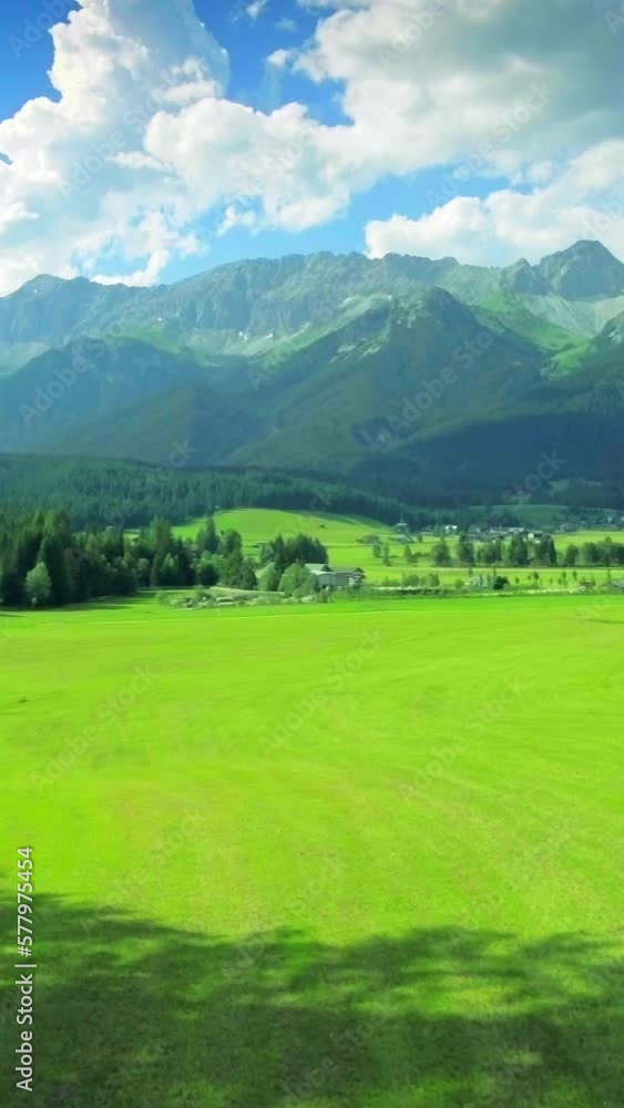 Idyllic countryside, small house, green meadow, evergreen forest, mountainscape, vertical social media background, reels Idyllic countryside, small house, green meadow, evergreen forest, mountainscape, vertical social media background, reels