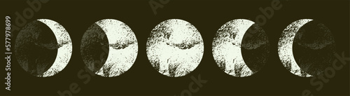 Vintage image of lunar cycles. Mystical drawing with phases of the moon. Textured moon in ink sketch style, print on black surface. Black and white illustration. Vector.