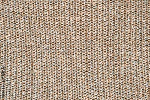 Seamless marl wool knitting pattern. White and light brown with green thread melange yarn fabric knitted texture. Up close