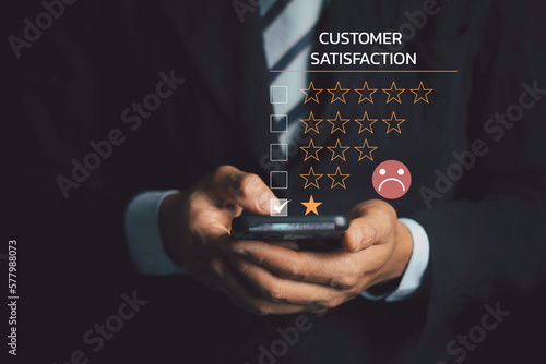 Customer Experience dissatisfied Concept, Unhappy Businessman Client with Sadness Emotion Face on smartphone screen, Bad review, bad service dislike bad quality, low rating, social media not good..