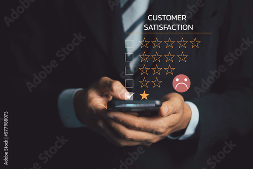 Bild auf Leinwand Customer Experience dissatisfied Concept, Unhappy Businessman Client with Sadness Emotion Face on smartphone screen, Bad review, bad service dislike bad quality, low rating, social media not good