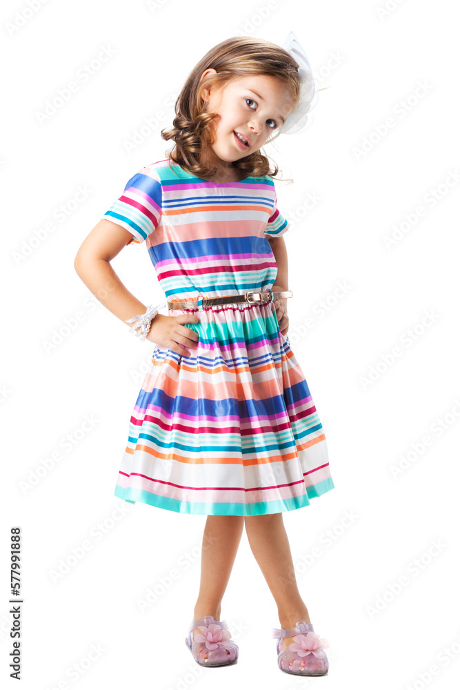 happy little girl wearing colorful dress posing in studio, isolated on white happy little girl wearing colorful dress posing in studio, isolated on white