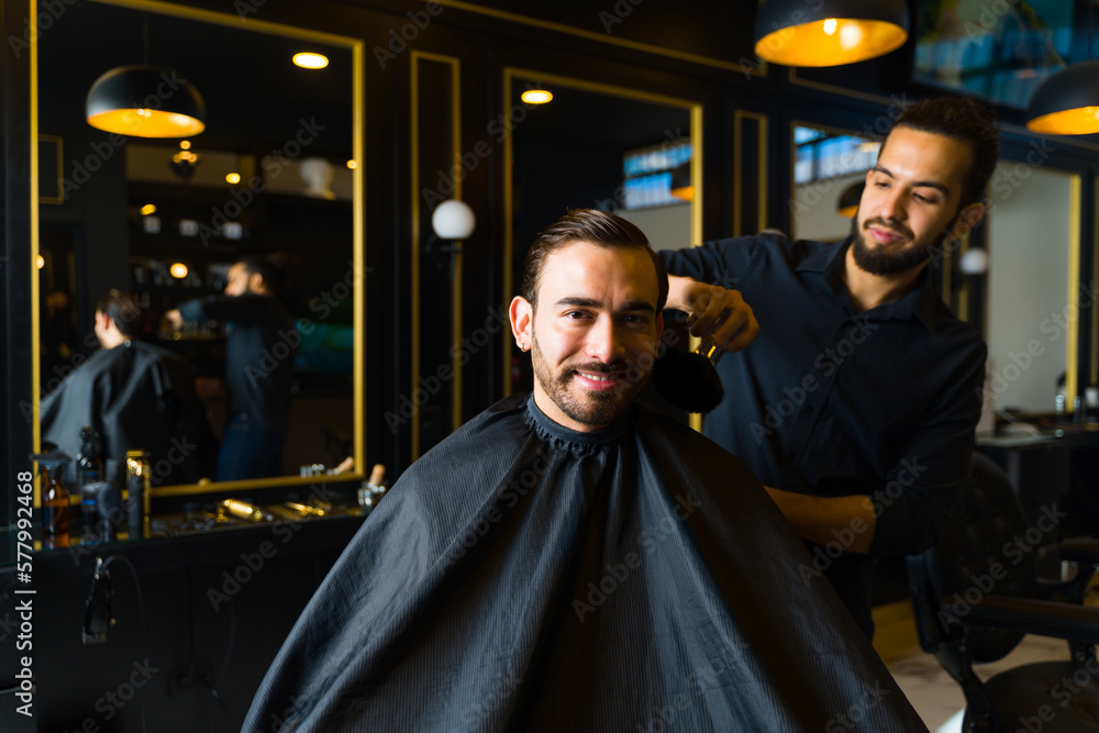 Happy attractive man coming to the barber shop Happy attractive man coming to the barber shop