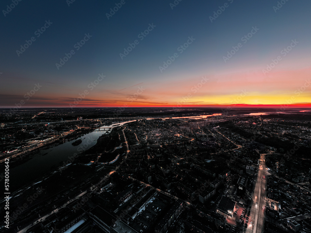 Aerial photo of sunset above night city Kaunas Lithuania,
