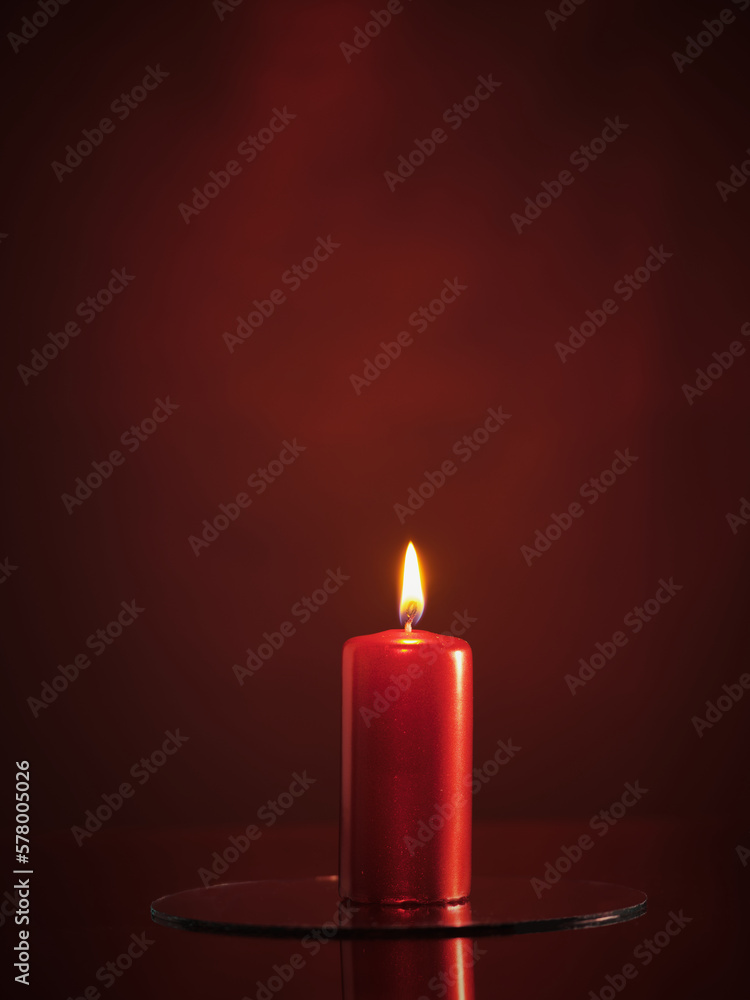 Red candle on a red background Red candle on a red background
