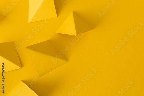 Abstract yellow background with triangle geometric shapes