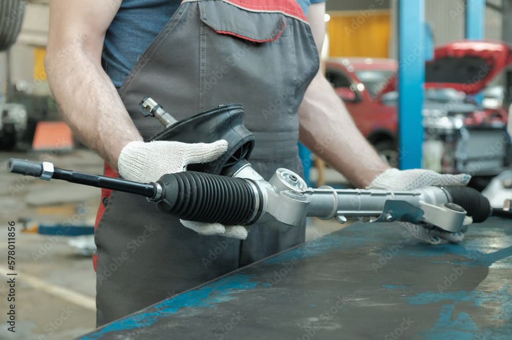 A component of the hydraulic power steering of the car. Steering rack