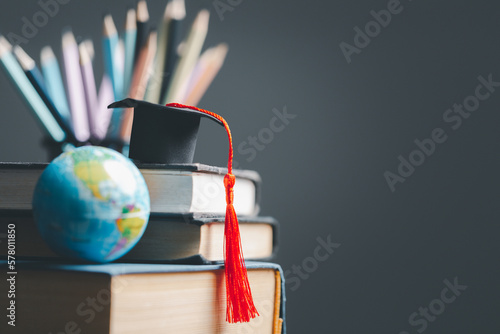 Graduation cap with Earth globe. Concept of global business study, abroad educational, Back to School. Education in Global world, Study abroad business in universities in worldwide. language study photo