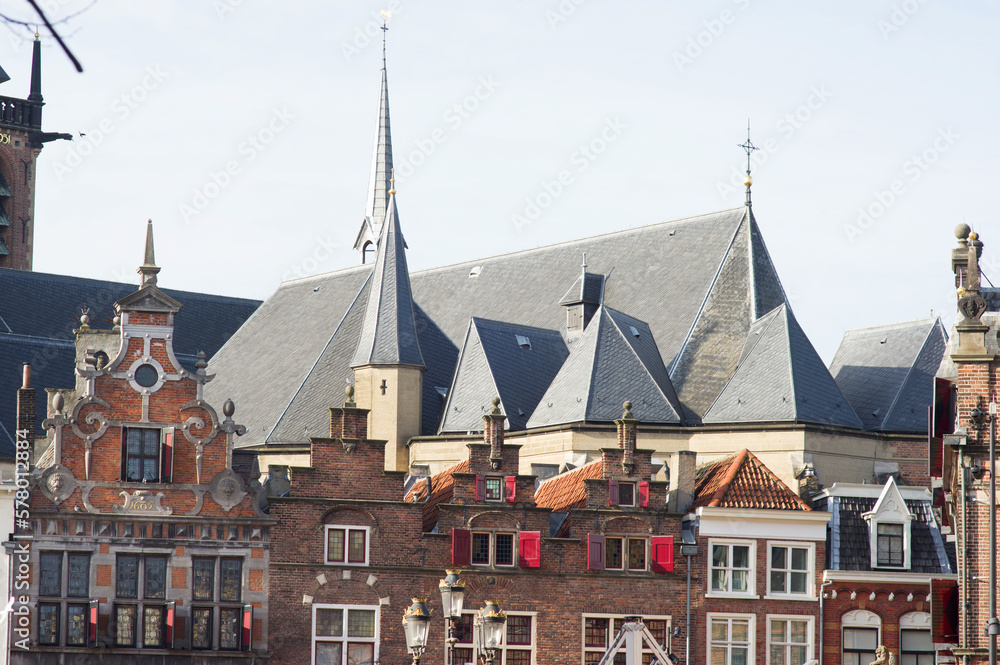 Roofs of a historic buildings in the center of Nijmegen with in the background the Stevenskerk in the Netherlands