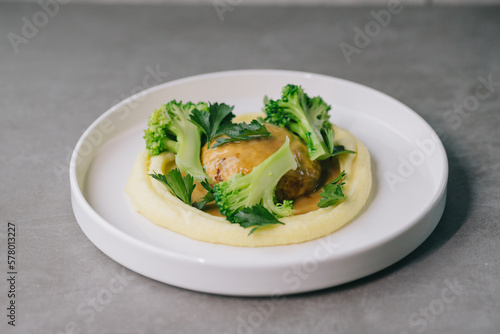 Food on an elegant white plate, lunch or dinner dish. Delicious food in a restaurant close-up.